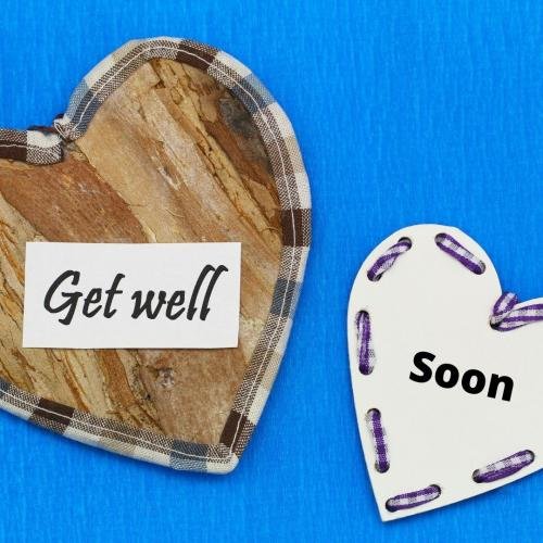 Get well soon with heart and blue background