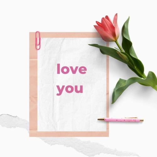 Flower and pen on wish card Love you.