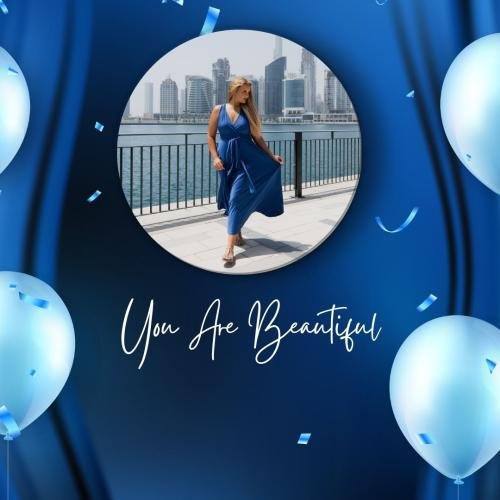 The girl looks beautiful in a blue dress.