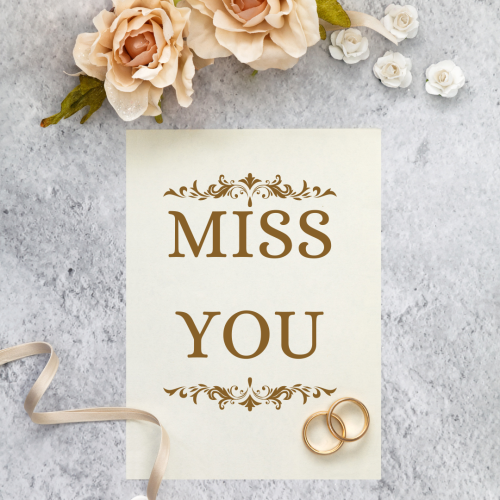Flowers and ring on a wish card, Miss You.
