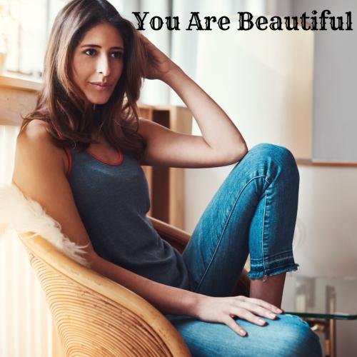 Girl sitting while modeling looks beautiful.