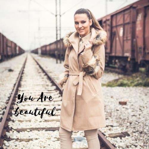 The girl is looking beautiful in the brown dress.