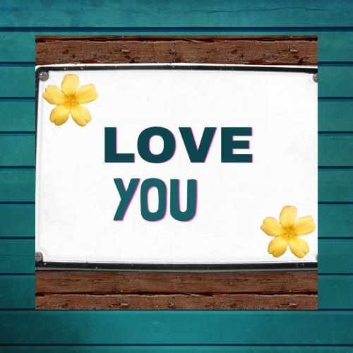 Yellow Flowers with a white board written Love you
