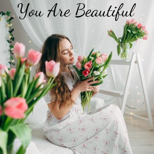 Girl looking beautiful with flowers and white dress
