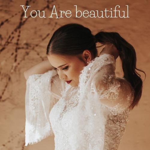 The girl looks beautiful in a white dress.