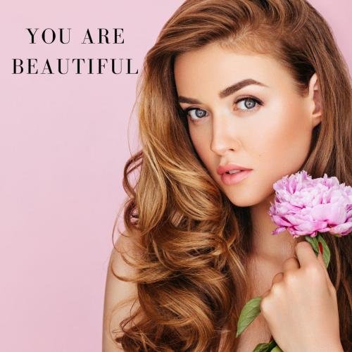 Girl looking beautiful with purple flower in her hand