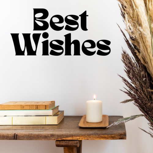 Best Wishes, books on a table and candle blowing.