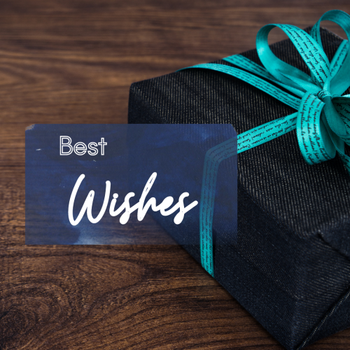 Best Wishes, a gift on a wood table.