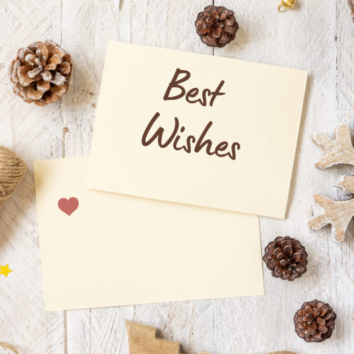 Two paper and items on the background, Best wishes.