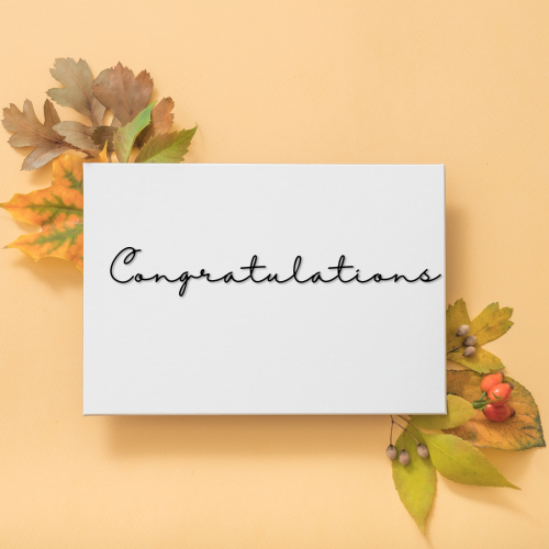 Flowers on background and a white paper, Congratulations.