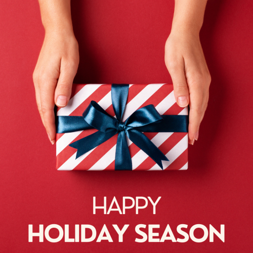 Happy holiday season, two hands holding a gift.
