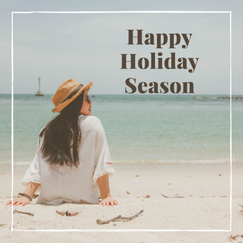 Girl sitting on beach, Happy Holiday Season.