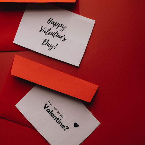 Happy Valentine's Day, red background and white paper on it.