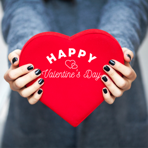 A girl holding a heart in her hands, Happy Valentine's Day.