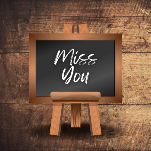 Miss you written on blackboard