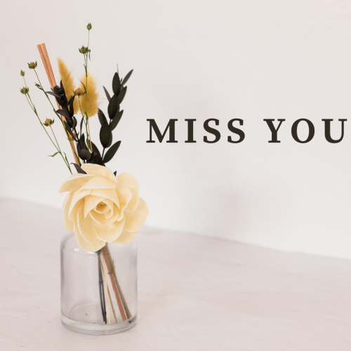 Miss you, flowers in a glass bottle.