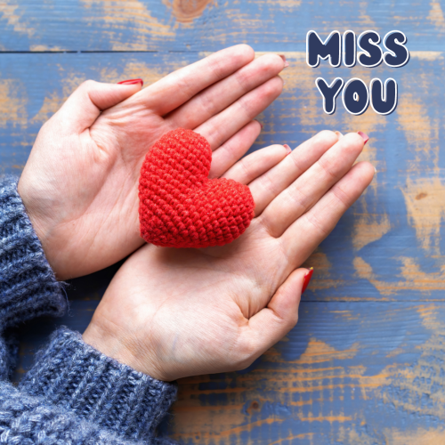 Women holding a heart, Miss You.