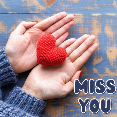 A women holding a heart in her hands, Miss You.